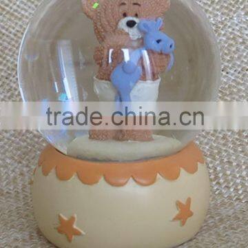 Hot sale eco-friendly warm color baby series snow globes wholesale