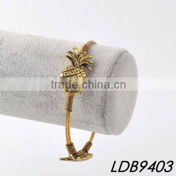 There gold pineapple bangle pineapple wrap bracelet