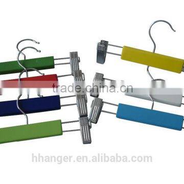 Solid hardwood hanger with elegant colored finish, used for child trousers, slacks or skirts