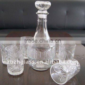 clear round glass wine bottle