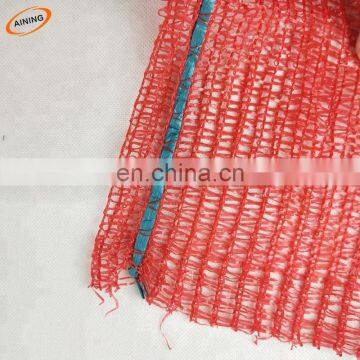 Plastic knitted mesh bag roll in packing firewood cabbage