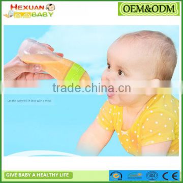 baby feeding bottle with spoon/squeeze feeder/Baby Silicone Squeeze Spoon