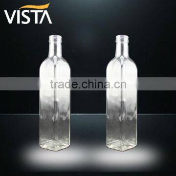 clear glass olive oil bottle