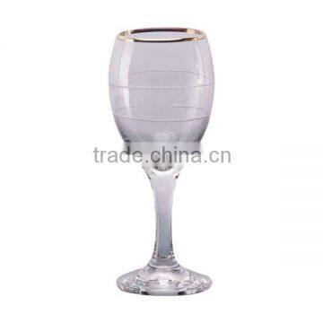 Wine glass with white decal and gold rim