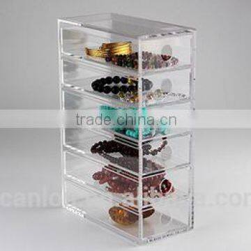 clear perspex box with drawers