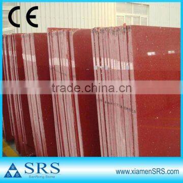 Polished artificial red quartz slab