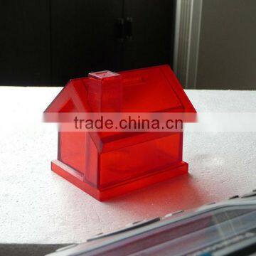 Plastic house shape coin bank