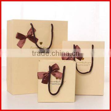 Designed Solid Shopping Paper Bags With Rope And Ribbon Wholesale