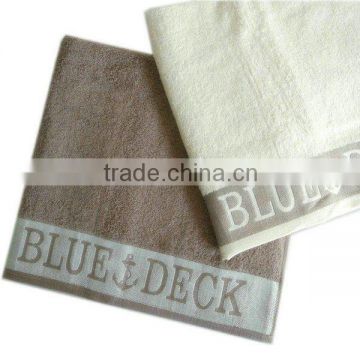 cotton jacquard towel with woven logo border