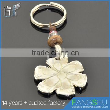 Wholesale fashionable metal snowflake keychain cheap for sale