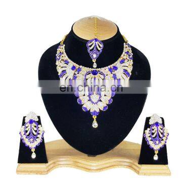 Touch Stone Gold Plated Blue Color Alloy Wedding Collection Necklace Earrings Set & Tikka