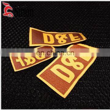 Wholesale gold jeans private clothing manufacturers polyester clothing weave label