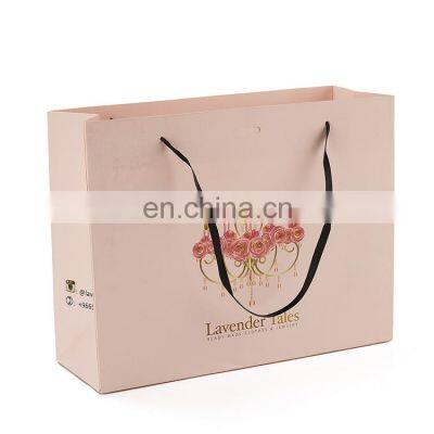 Luxury Custom Logo Gold Foil Printed White Cloth Paper Packaging Bag With Handle photo-1