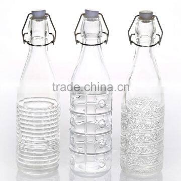 Hot Sale Various Of Embossed Pattern Transparent Glass Water Bottle With Lid