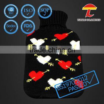 Natural rubber hot water bottle with Cupid's arrow design knitted cover