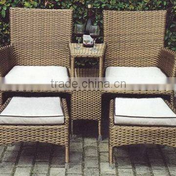 rattan table and chair and it is love set with two footrest with comfortable cushion