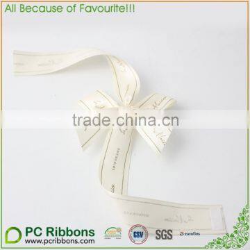 Gift packaging with blue ribbons and bow