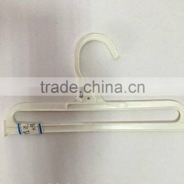 white plastic towel hangers
