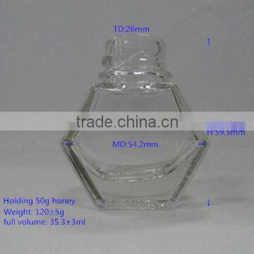 holding 50g Honey glass jar