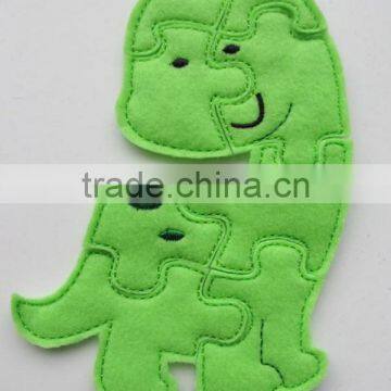 2017 hot new bestselling product wholesale alibaba handmade Green Dinosaur Felt Puzzle travel game made in China