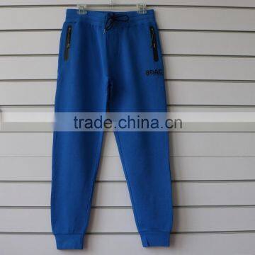 100% cotton men jogging pants with side waterproof pockets and logo print