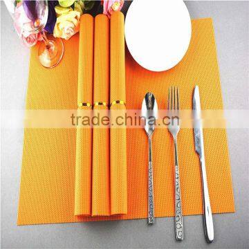 Factory price 75g PVC woven straw placemat orange pure color 1*2 series 45*30cm