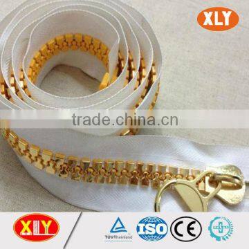 xly fancy white tape gold teeth zipper , plastic zipper