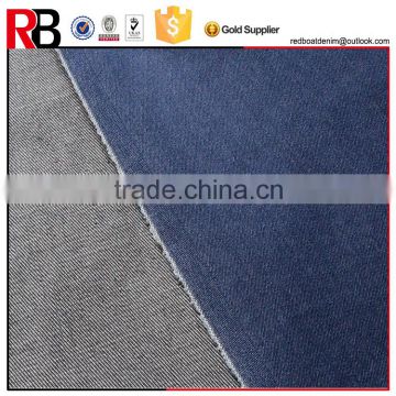 Wholesale indogo color denim fabric jeans material in foshan