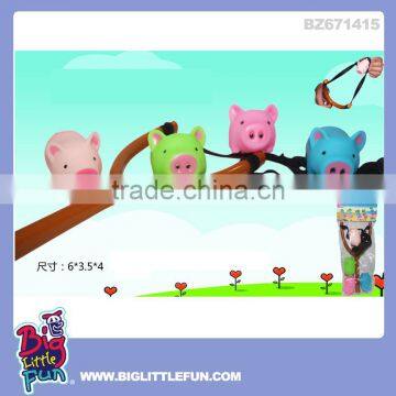 Plastic slingshot toy pig