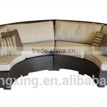 U shaped outdoor patio brown wicker sofa couch with beige cushions