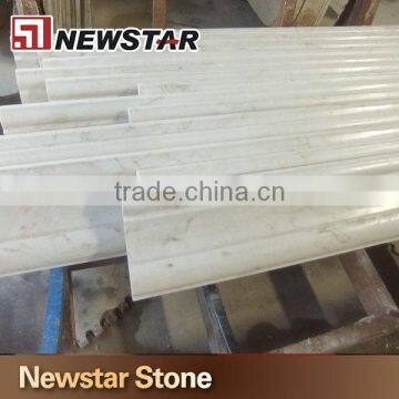 Polished white marble chair rail, marble mouldings, marble trim