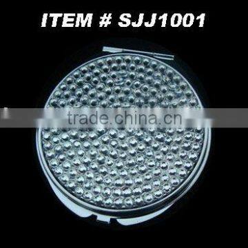 diamond-studded compact mirror