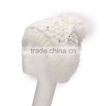 Chunky shining knitted cap with fur earmuffs