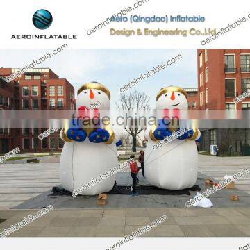 Large inflatable snowman with gift decoration
