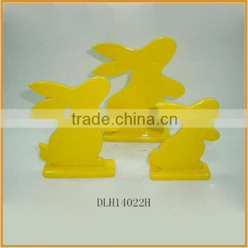 Yellow color ceramic material adornment rabbit