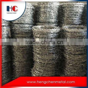 Barbed wire coil fence