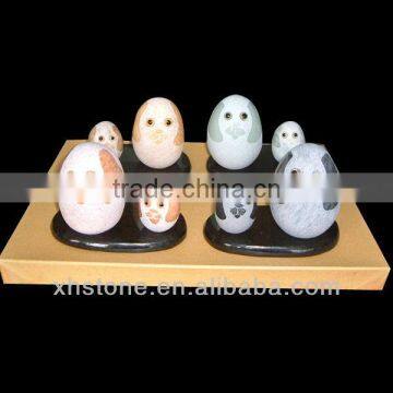 Various colors of egg shape stone dog statue