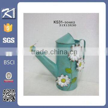 Garden galvanized watering can with flower