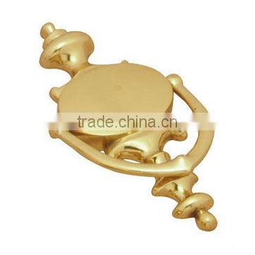 golden brass door knocker