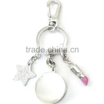 metal round shape solid perfume container keychain, with star & lipstick charm , OEM designs accepted.<DKCA9210>