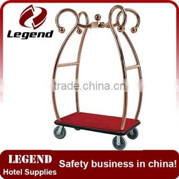 Used hotel luggage cart in bronze plated