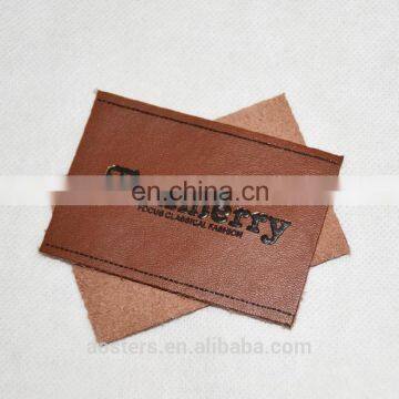 Hot Sell custom machine embossed pu leather labels Jeans With Letter Logo
