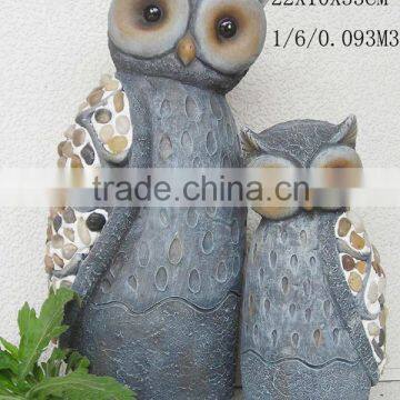 Decorative owl statue outdoor garden decor.