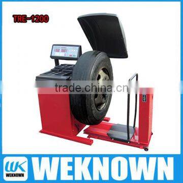 Auto tire changer wheel balancer