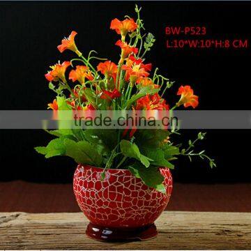 red ceramic flower vase