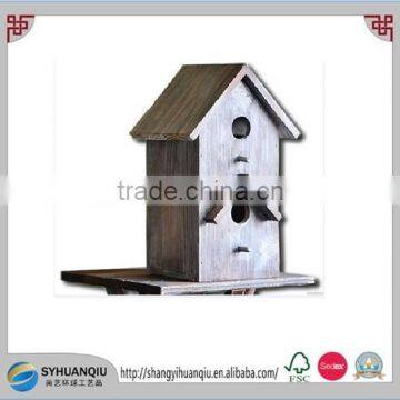 Wooden bird cage with two cells and two eaves