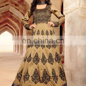 Beige Colored Taffeta Silk Heavy Embroidered Festive Wear Suit.