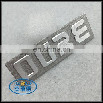 Personalized logo style embossed metal badge