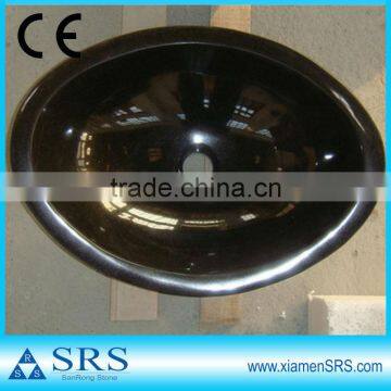 Polished black oval stone basin