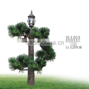 Plastic pine tree with solar lamp for outdoor decoration